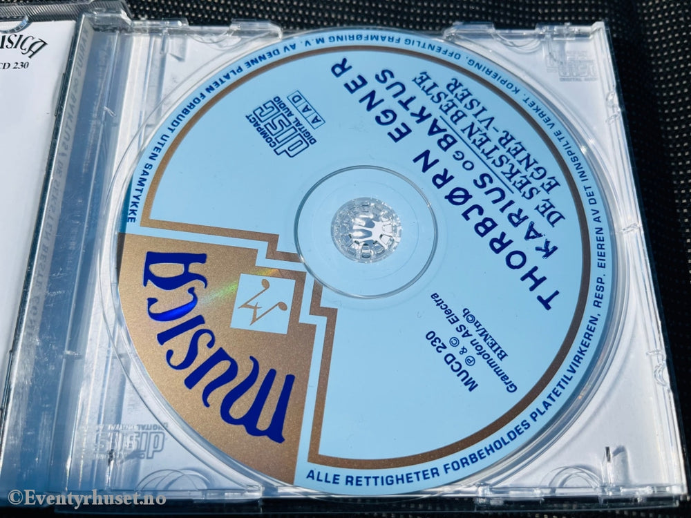 Thorbjørn Egner. 1993. De Seksten Beste Egner-Viser Pluss Karius Og Baktus. Cd (Blå). Lydbok