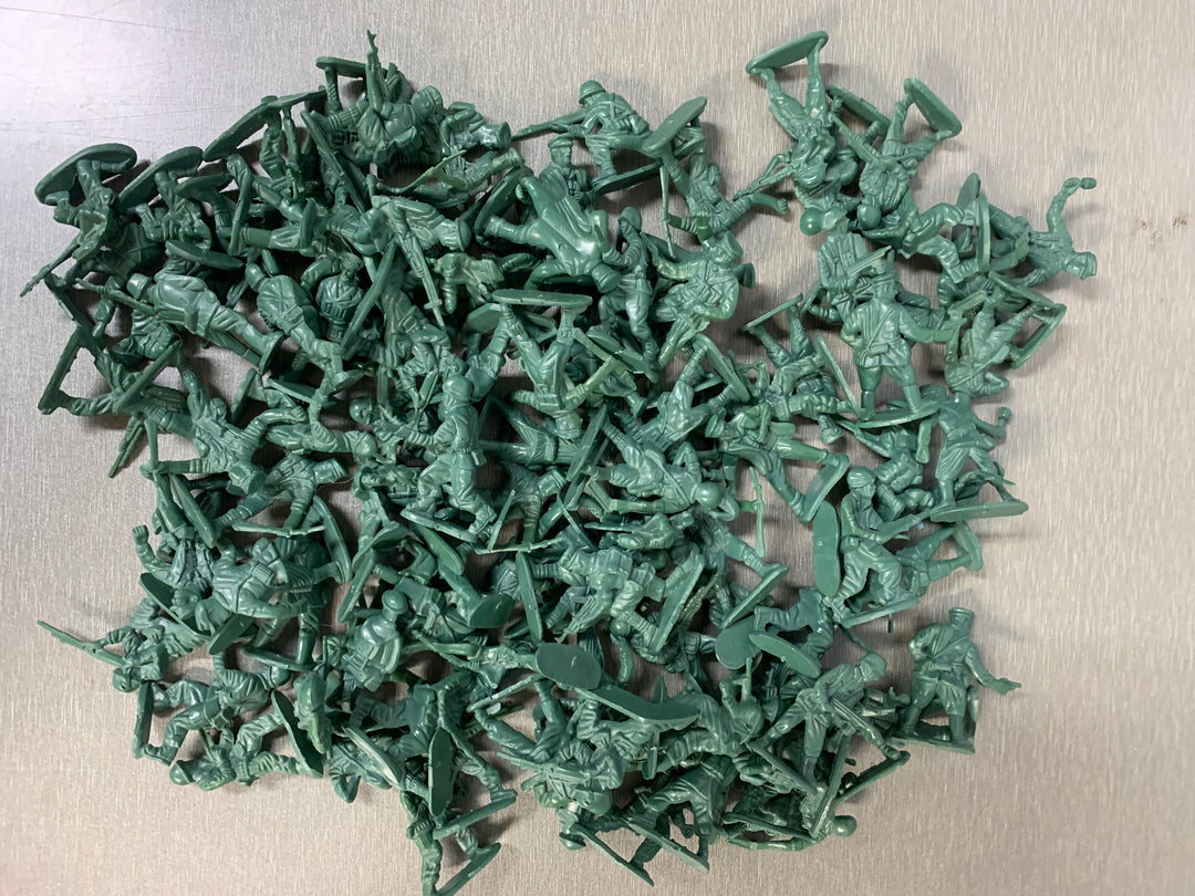 Stor samling grønne plastfigurer