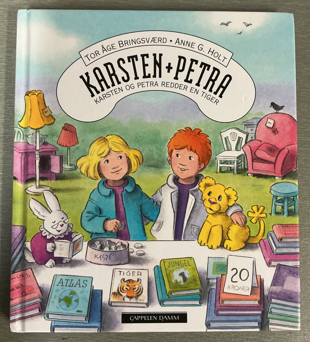 Tor Åge Bringsværd og Anne G. Holt. Karsten og Petra redder en tiger. Bok.