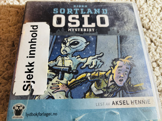 Bjørn Sortland. 2012. Oslo-mysteriet. Lydbok på CD (fra bibliotek, pene disker).