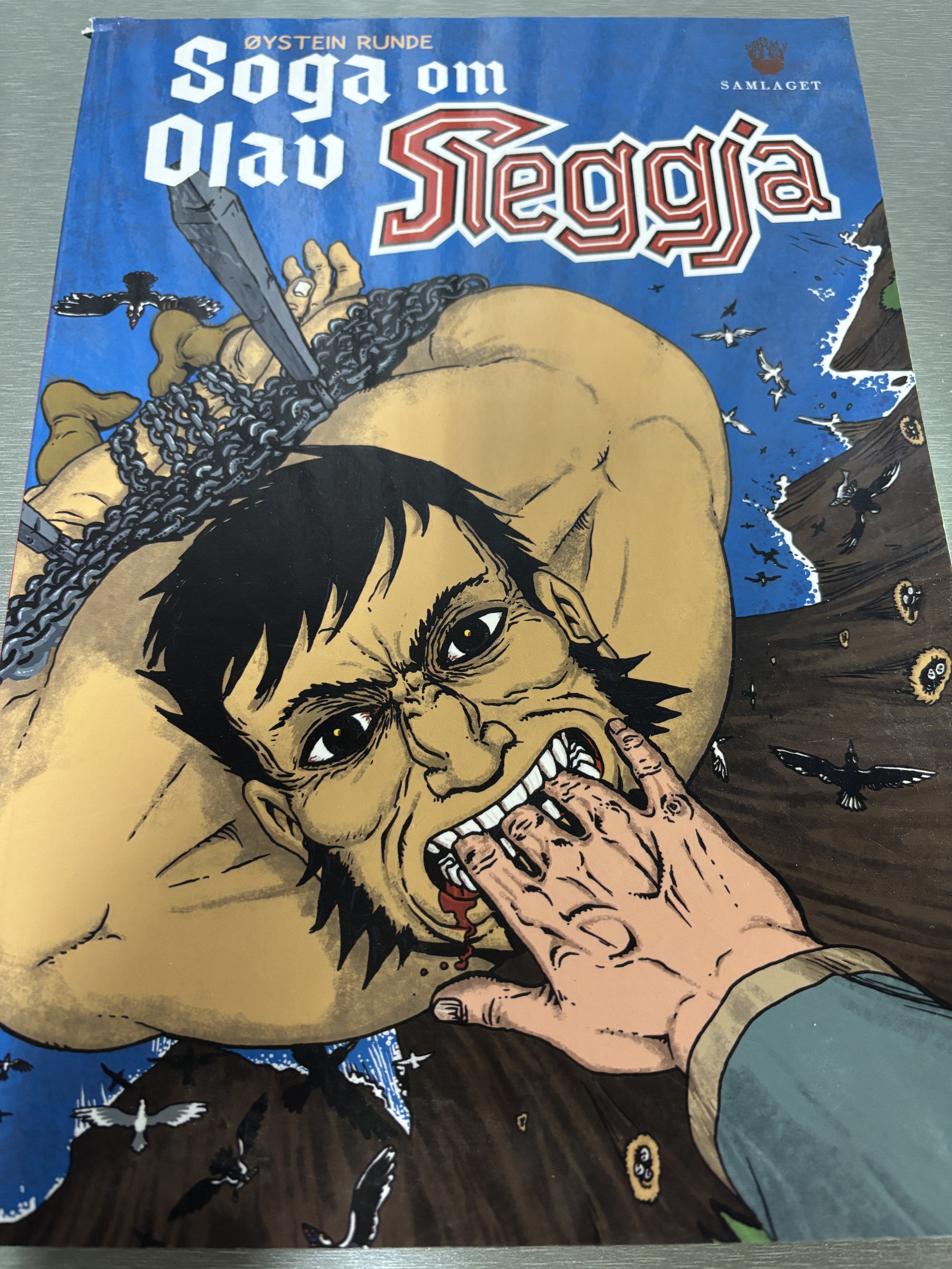 Soga om Olav Sleggja av Øystein Runde. 2000-tallet. Tegneseriealbum.