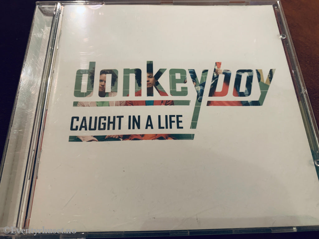 Donkeyboy. Caught In Life. 2009. CD.