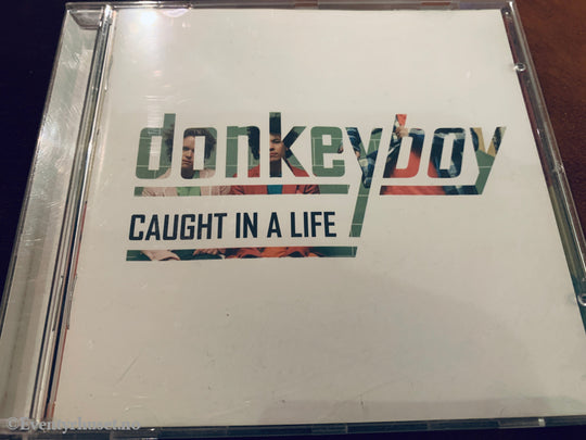 Donkeyboy. Caught In Life. 2009. CD.